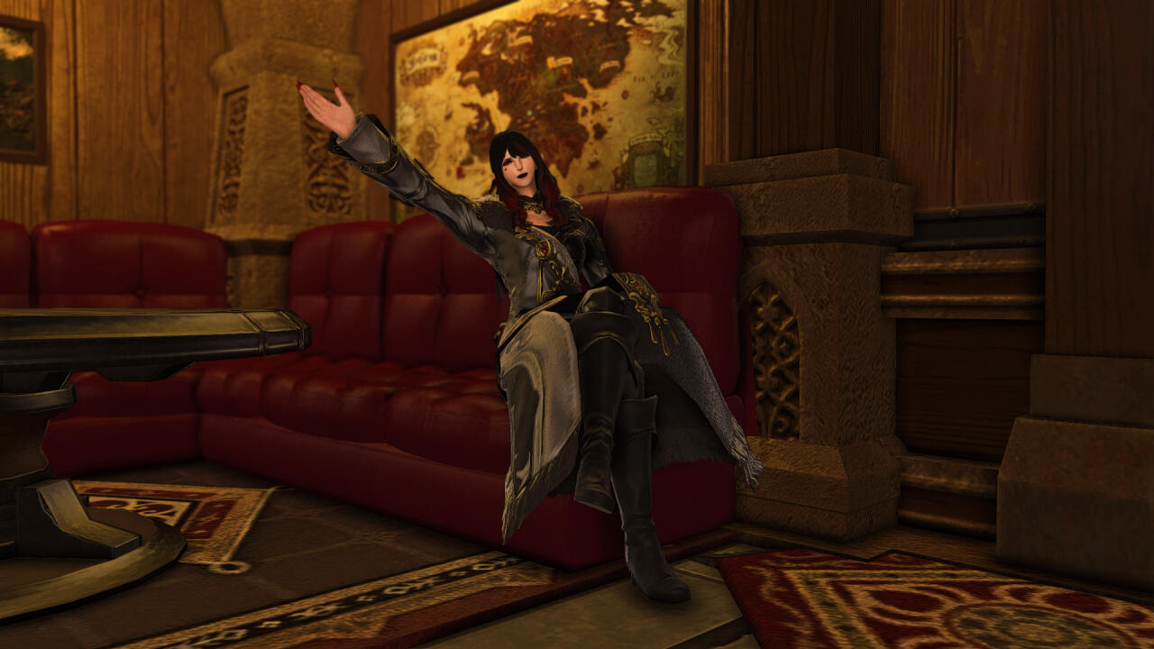 An image of Marigold sitting on one of the venue's booth sofas, motioning joyously to greet the photographer. She is donning a black dress with many red and gold accessories, accompanied by black pants with gold trim and black knee-high boots.